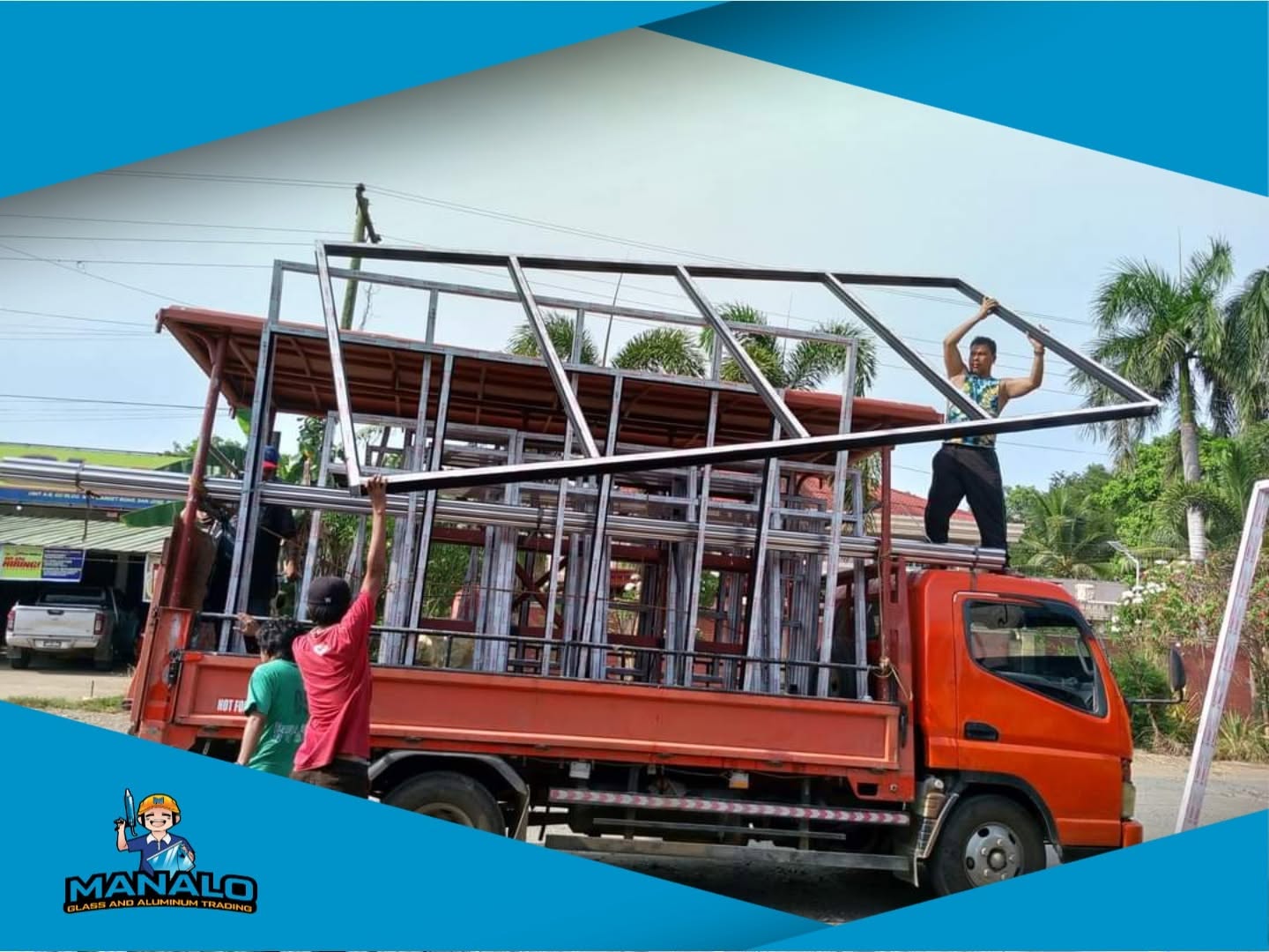 Manalo Glass team loading aluminum frames onto a delivery truck